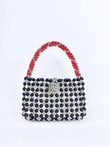 Handmade beaded tote bag with black and silver grid patterns and red beaded handles