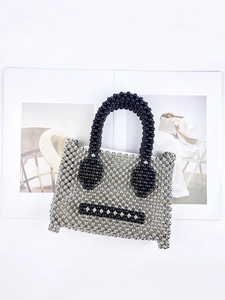 Silver beaded tote bag with black pearl smiley face and dual black circular top handles