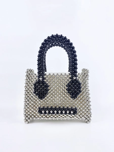 Silver bead tote bag with black minimalist sad face expression and round top handle