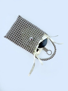 Elegant silver beaded square handbag with satin ribbon drawstring and metallic luster finish