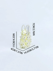 Detailed view of mini faux pearl handbag with dimensions and smooth satin lining