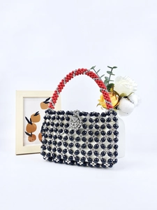 Handmade beaded square tote bag with black silver geometric mesh and red woven handle