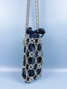 Artisanal silver metal beaded hollow-out crossbody bag with blue satin bow interior