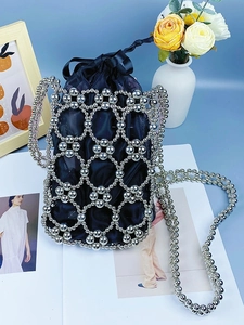 Handmade woven pearl beaded crossbody bag with silver metal rings and navy drawstring liner