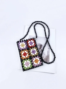 Handmade colorful beaded shoulder bag with floral geometric patterns and black strap