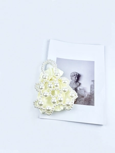 Handmade cream pearl woven handbag with satin drawstring bag for elegant women