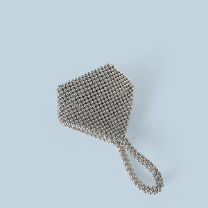 Detail view of handmade silver beaded envelope clutch bag with intricate woven metal beads