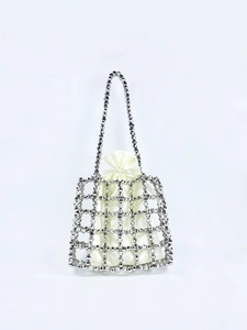 Detail of silver beaded handbag with ivory satin drawstring pouch inner lining