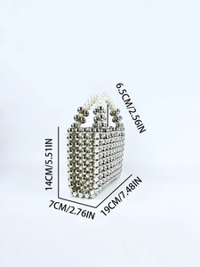 Detail view of handmade beaded mini tote with dimensions 19x7x14cm and silver accents