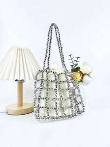 Silver beaded handmade tote bag with satin drawstring pouch in minimalist white setting