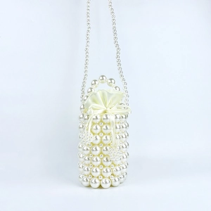Close-up of handmade pearl woven bucket bag with satin drawstring closure and strap