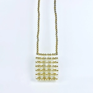 Detail showing the intricate gold and clear bead weaving of this handmade mini bag