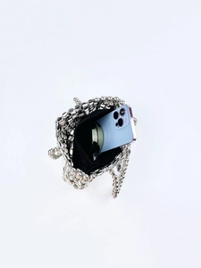 Detail view of silver beaded handbag showing internal capacity and black fabric lining