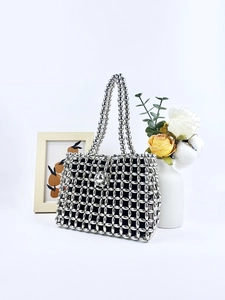 Silver metallic beaded woven handbag with mesh design and large dome clasp detail