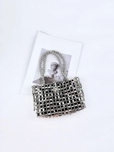 Silver beaded tote bag with retro mesh pattern and metallic beads on a white art card