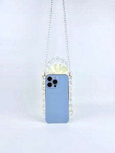 Detail of beaded bag with yellow satin lining showing its capacity to hold a smartphone