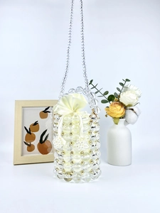 Handmade clear beaded barrel bag with yellow satin drawstring pouch and shoulder strap