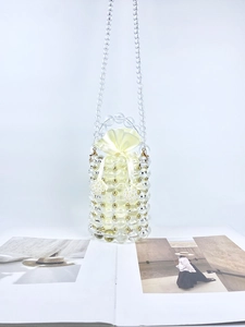 Handmade clear beaded barrel bucket bag with gold accents and drawstring satin liner