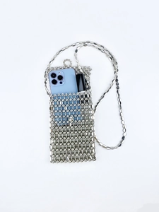 Macro detail of silver sequin beaded phone bag with metal chain strap and grid structure