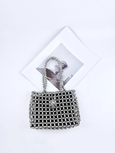 Handmade silver beaded hollow handbag with black inner bag and metal ball clasp detail