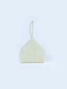 Detail of hand-woven pearl beaded handbag featuring intricate white acrylic beads and texture