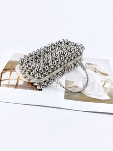 Elegant silver beaded evening clutch bag with ornate floral round handle for formal dresses