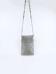 Detail of silver beaded handmade woven phone bag with slim metal chain strap