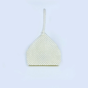 Detail of handmade pearl woven handbag with triangle structure and elegant bead closure