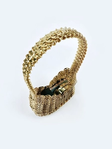 Detailed view of handmade gold metal mesh handbag with vintage linked ring design