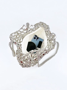 Silver beaded bag interior with white lining and chain strap for daily essentials