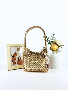 Handmade gold sequin metal mesh handbag with woven top handle and shimmering metallic finish