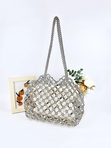 Silver hollow woven shoulder bag with white drawstring liner and diamond lattice beads