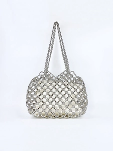Silver hollow out beaded handbag with white drawstring pouch for elegant fashion
