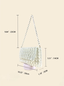 Detail shot of pearl shoulder bag dimensions 26x14x3 cm with 25cm strap length