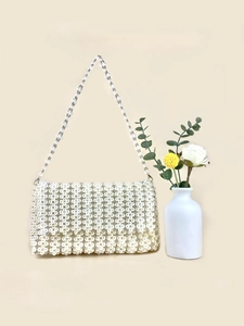 Exquisite handmade pearl beaded shoulder bag with vintage woven texture and pearl strap
