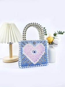 Handmade beaded tote bag with blue pink heart design and evil eye bead charm