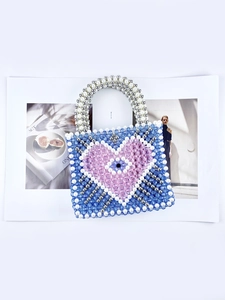 Handmade beaded handbag with blue and pink heart pattern and pearl white handles