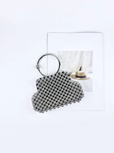 Elegant silver handmade beaded shell clutch bag with a modern metal ring handle