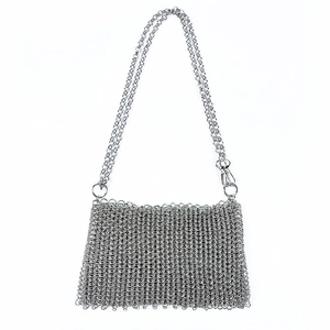 Detailed view of silver chainmail crossbody bag with fine metal link weave and dual chains