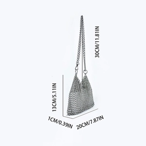Detail view of silver metal mesh crossbody bag with precise dimensions and chain strap