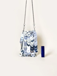 Mini silver sequin evening bag with metal chain strap shown next to a lipstick for scale
