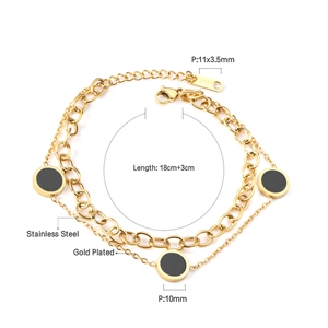 Detail of 18K gold-plated stainless steel double-layer bracelet with black round discs