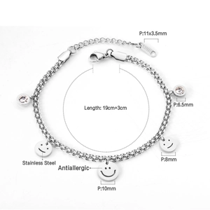 Detail of stainless steel double-layer bracelet with smiley faces and zircon charms