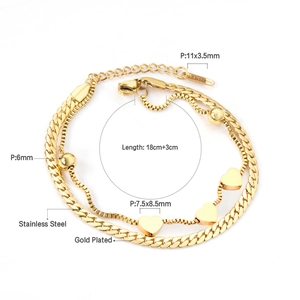 Detailed view of double-layer stainless steel gold plated bracelet with heart and bead charms