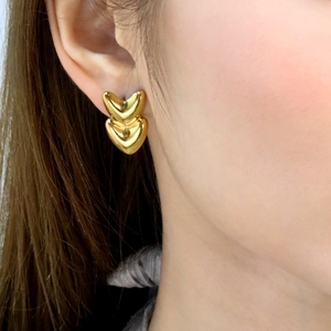 French style double heart stud earrings in 18K gold plated stainless steel on model