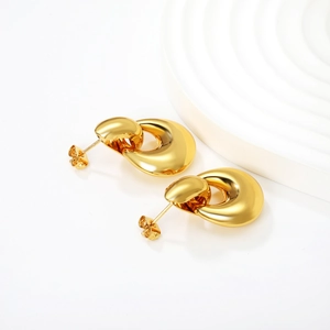 Macro detail of high-polish 18K gold plated hollow teardrop stud earrings for women