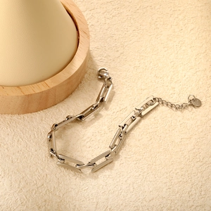 Polished silver stainless steel rectangular link bracelet with lobster clasp and tag