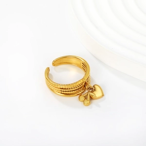 Detailed view of gold triple-layered textured open ring with twin heart charms