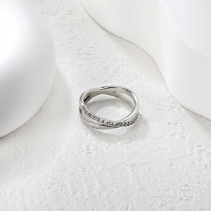 Crossed double band silver ring with fine pavé cubic zirconia on textured stone base