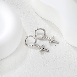 Polished stainless steel hoop earrings with 3D four-pointed star pendants on white background